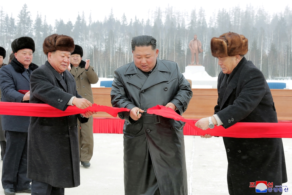 North Korean leader Kim Jong Un cuts the ribbon during a ceremony at the township of Samjiyon County  / KCNA